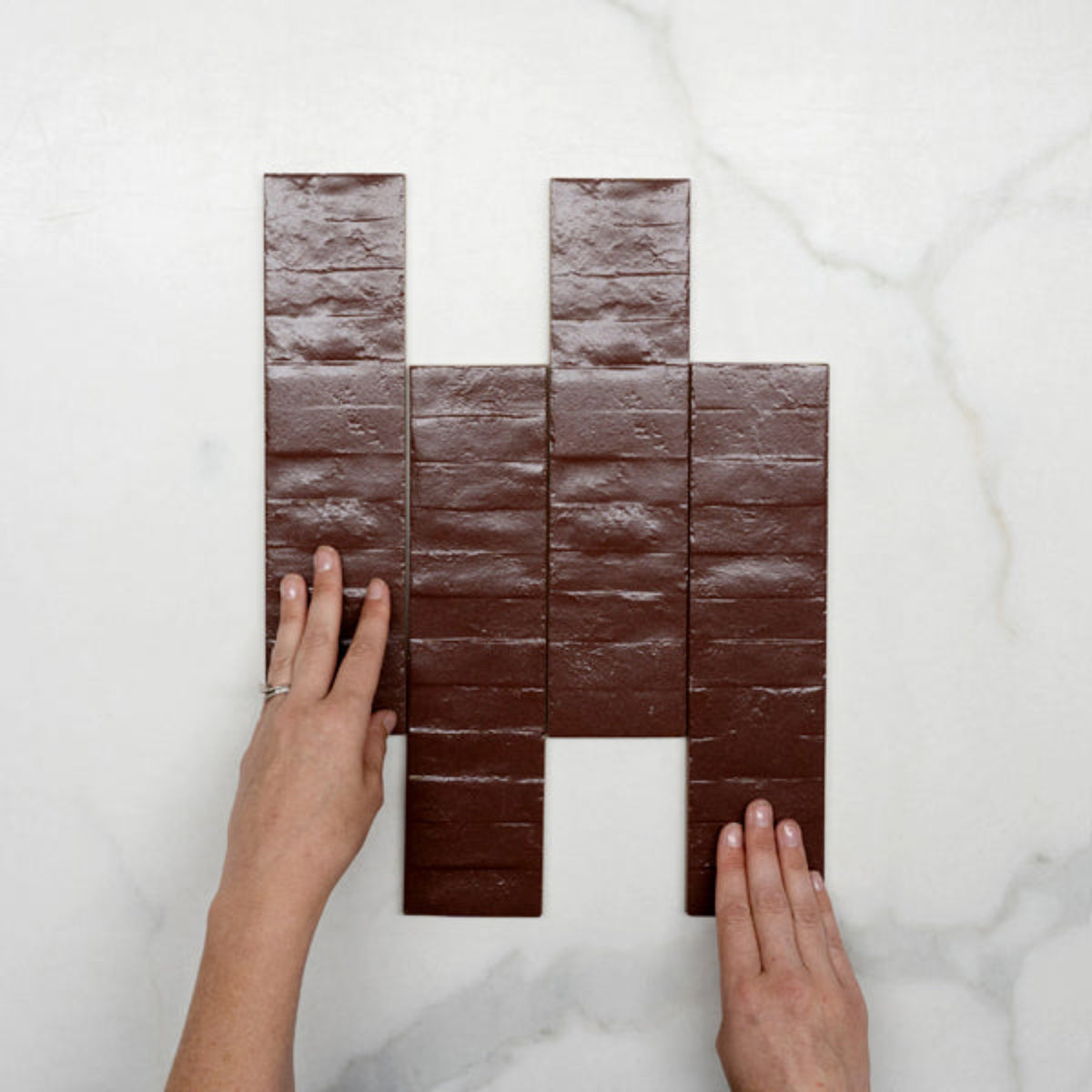 Pattern With Hand Burgundy Olivia Feature Subway Matte 75 x 300mm Porcelain - The Blue Space