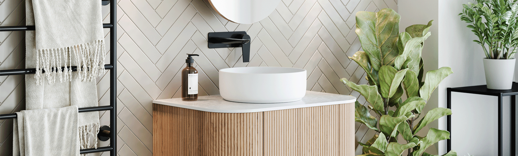 A bathroom design with natural and contemporary elements, tiles, timber vanity, green plants. 