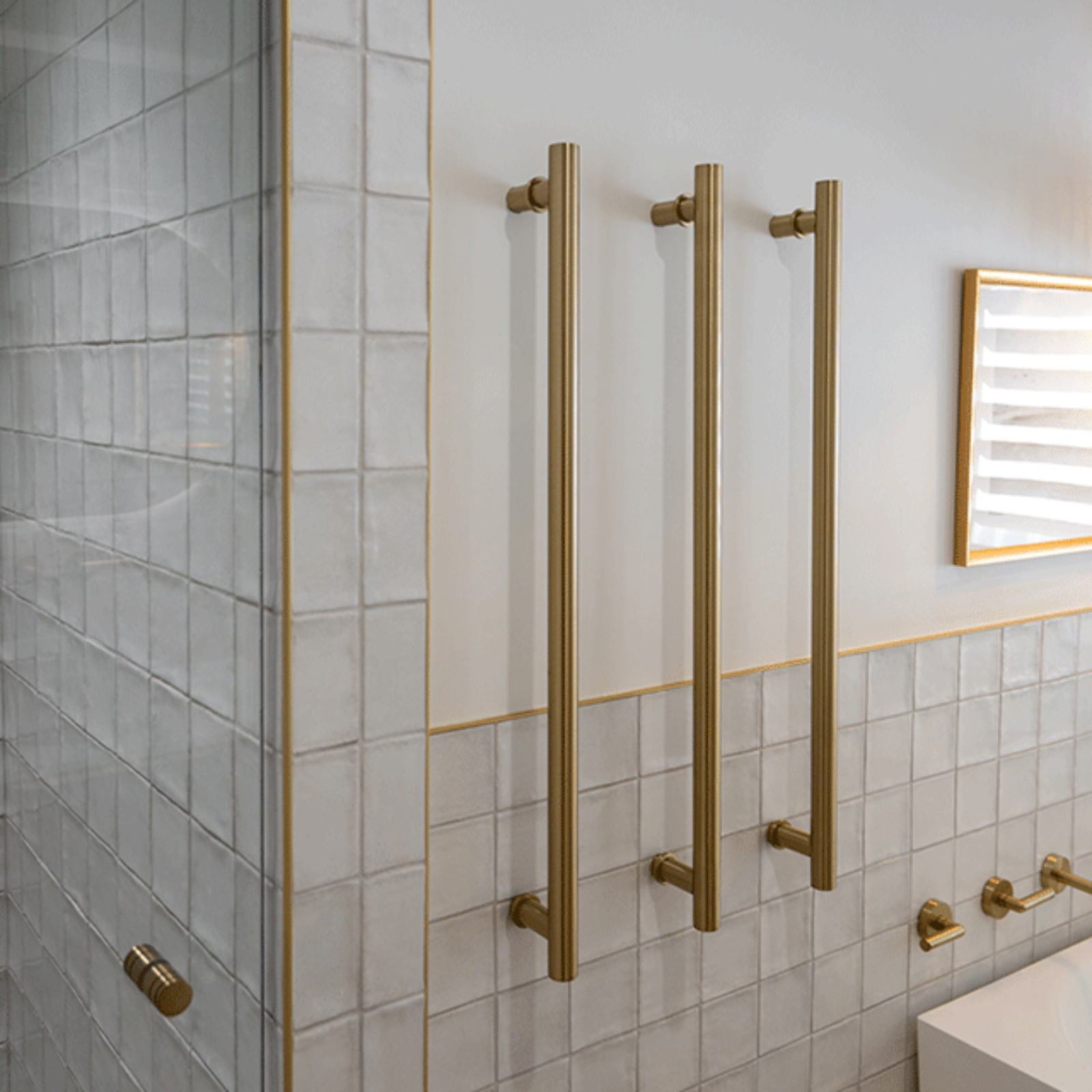 White Dianna Zellige Tile 100 x 100 x 9mm Spanish Ceramic and Phoenix brushed gold heated towel rail and Bao corner bath