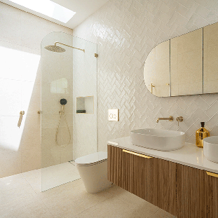 Timber fluted wall hung bathroom vanity, in wall toilet suite, beige and white tiles, gold tapware and bathroom accessories. Shop bathroom, kitchen and laundry fixtures and fittings in stock  in our warehouse at The Blue Space