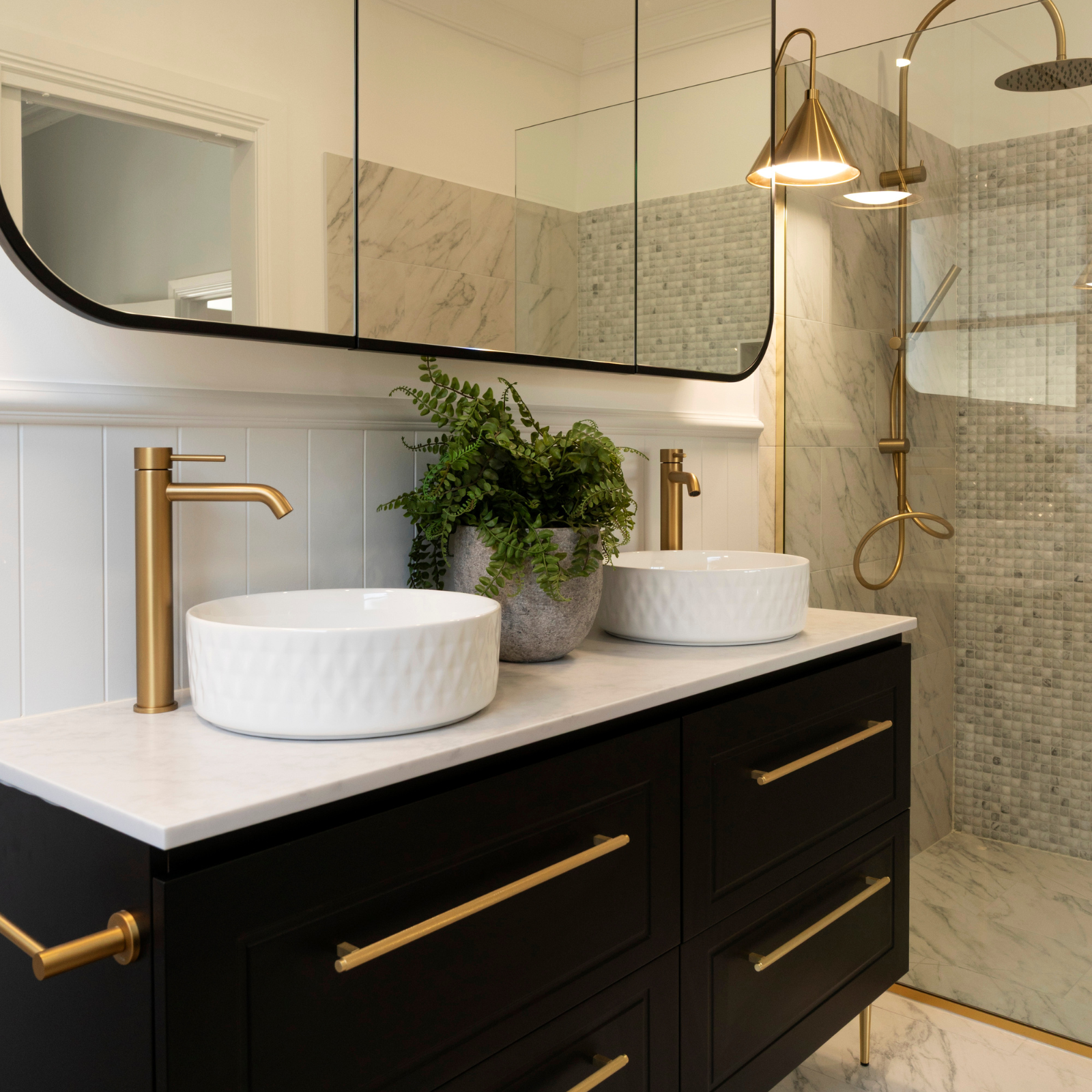 Two Bathrooms, One Cohesive Vision