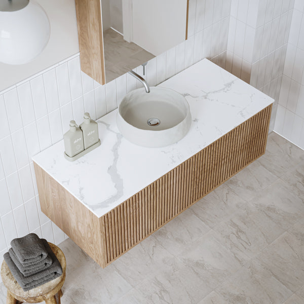 Ingrain Calacatta White Sintered Stone benchtop on Ingrain Grooved Timber Wall Hung Vanity. Breezy coastal bathroom design at The Blue Space.
