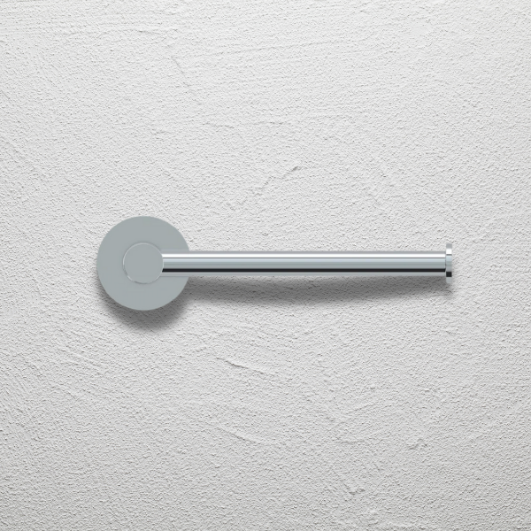 Indigo Ciara Toilet Roll Holder in chrome finish on textured white wall | The Blue Space